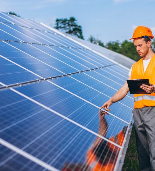 man-worker-firld-by-solar-panels man-worker-firld-by-solar-panels